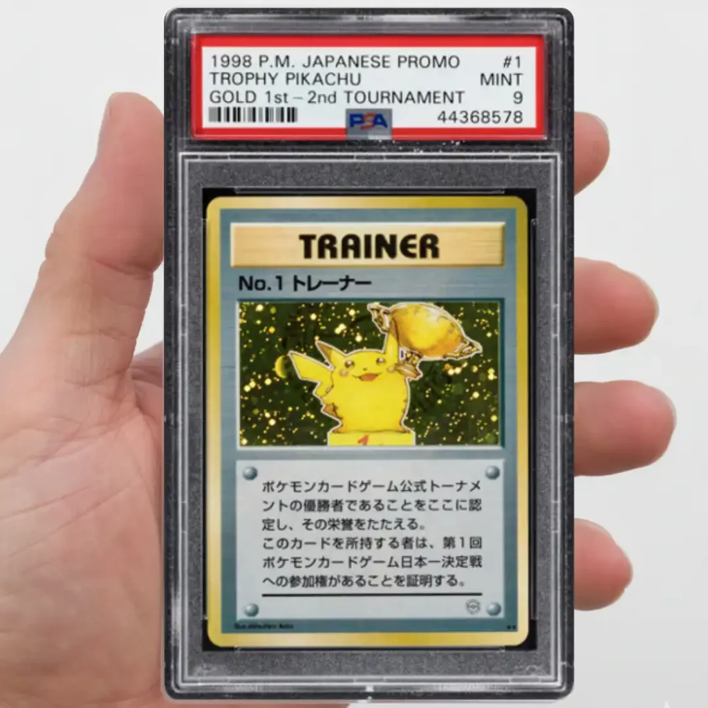 Carta Pokémon Trophy Pikachu No. 1 Trainer de 1998 certificada PSA 9 sostenida en mano
